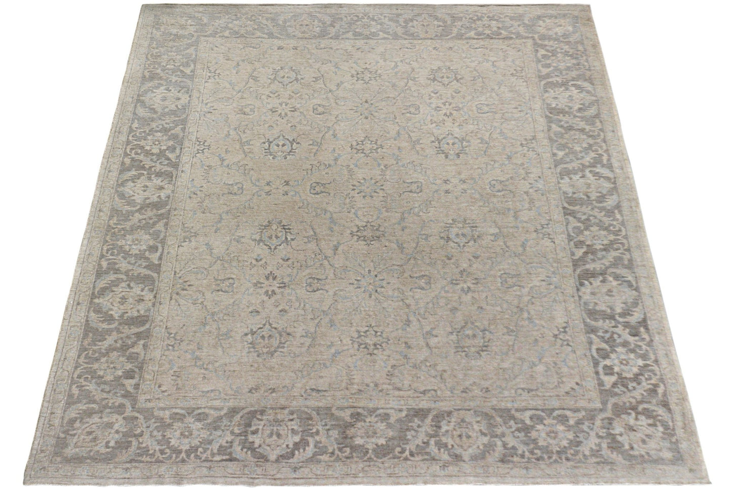 A handmade Afghan Chobi rug featuring a traditional floral pattern in neutral beige and grey tones.