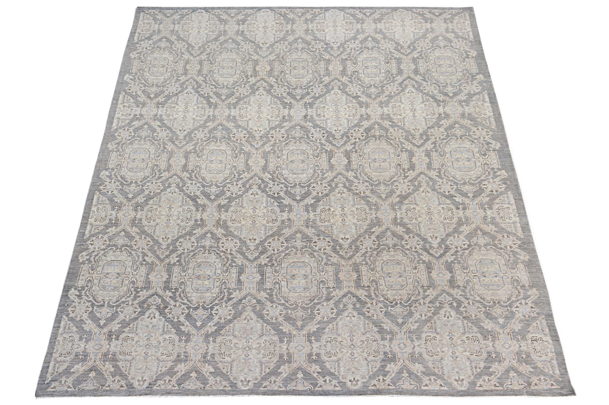 An Afghan Chobi rug featuring a traditional grey and beige geometric pattern.