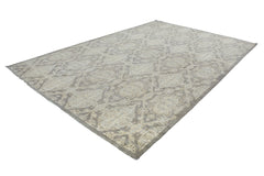 An Afghan Chobi rug featuring a traditional geometric pattern in neutral wood-toned colors.