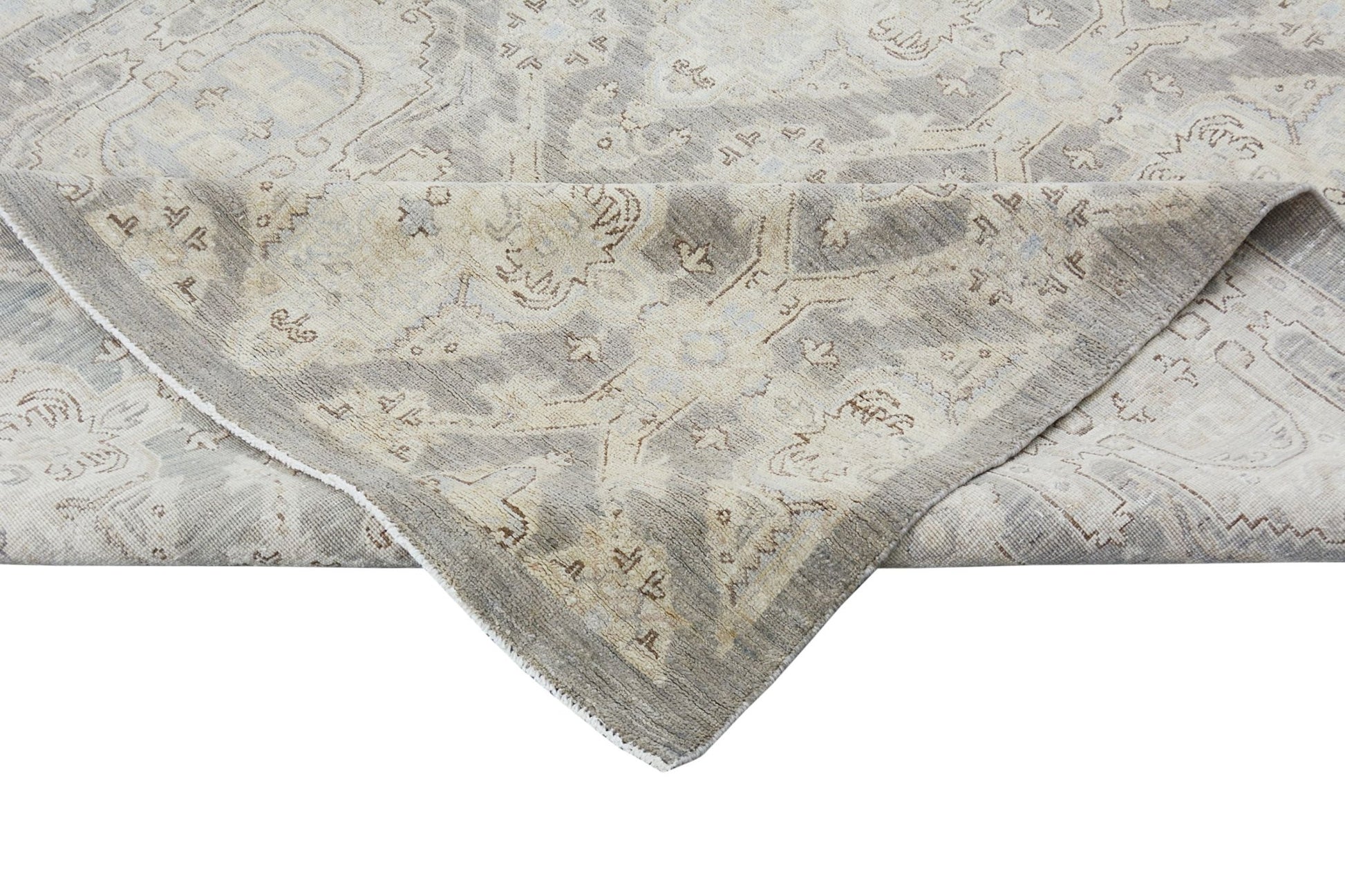 A handmade Afghan Chobi rug featuring a traditional pattern in neutral beige and grey tones.