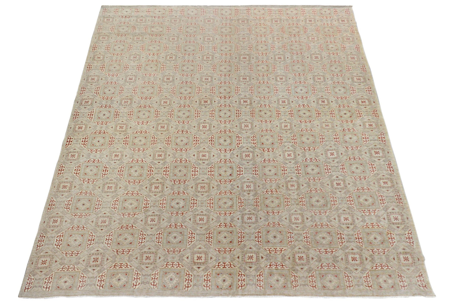 An Afghan Chobi rug featuring a repeating geometric pattern in soft earth tones.
