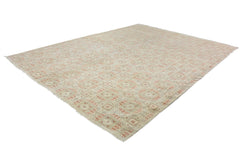 An Afghan Chobi rug featuring a repeating geometric pattern in soft earth tones.
