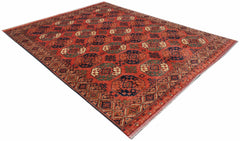 An Afghan Chobi rug featuring a traditional geometric pattern in shades of red, blue, and cream.