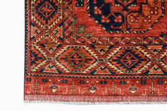 A handmade Afghan Chobi rug featuring traditional geometric patterns in red, blue, and cream.