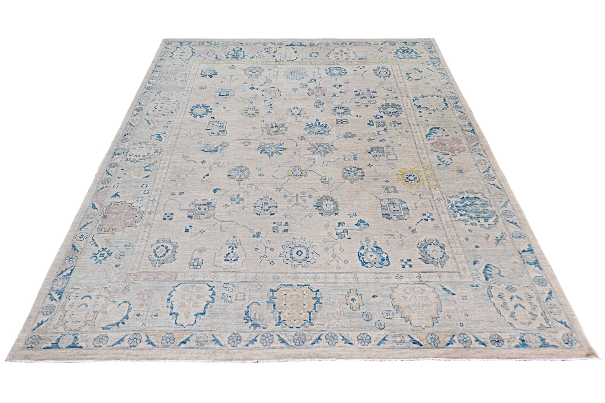 An Afghan Chobi rug featuring a traditional floral pattern in blue and beige tones.