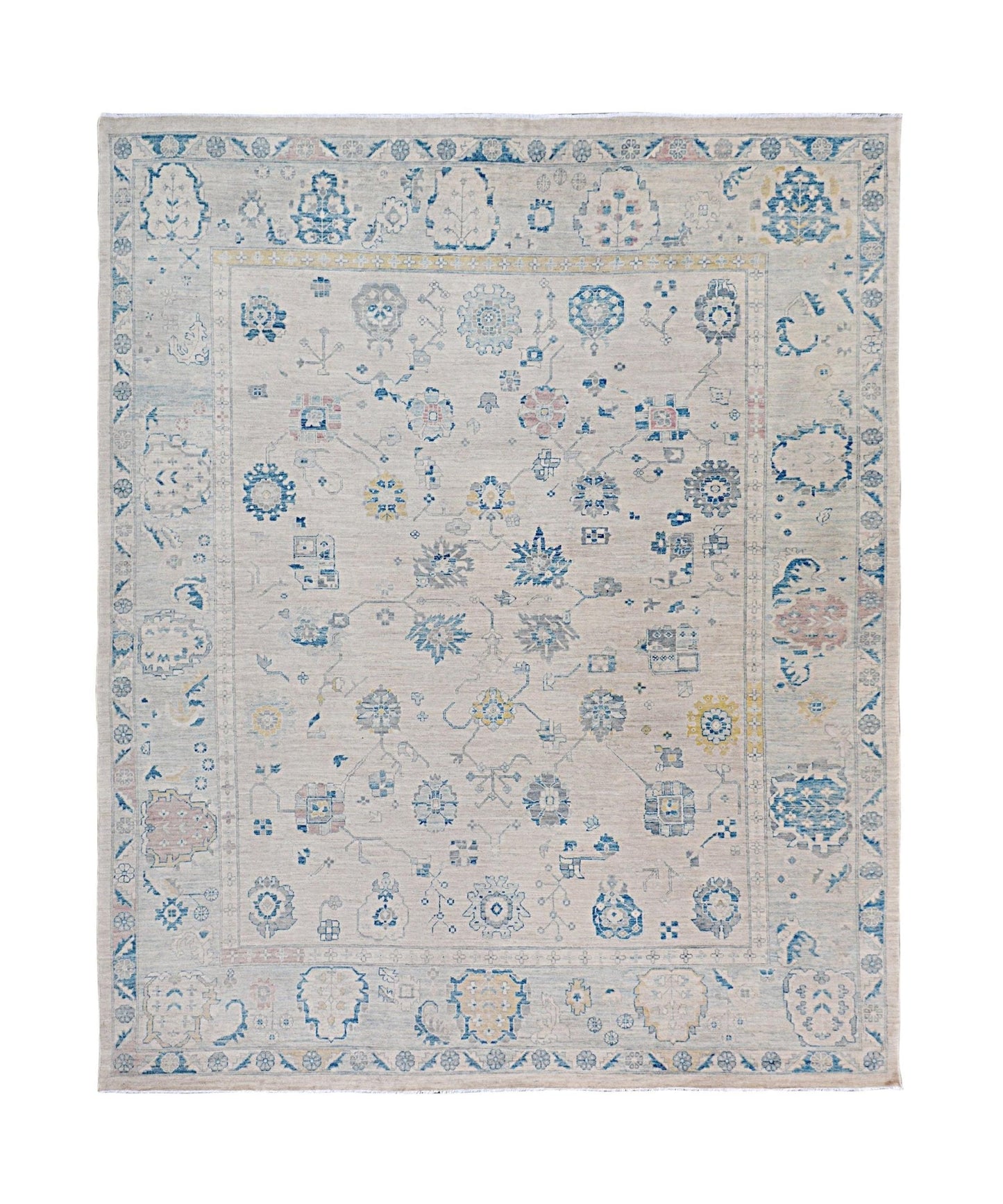 Handmade Afghan Chobi rug featuring a traditional floral pattern in blue and beige tones.
