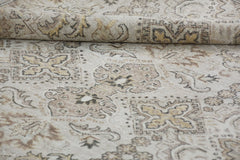 A handmade Afghan Chobi rug featuring traditional patterns in neutral wood tones.