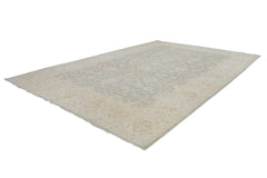 A rectangular Afghan Chobi rug featuring a traditional floral pattern in soft beige and grey tones.