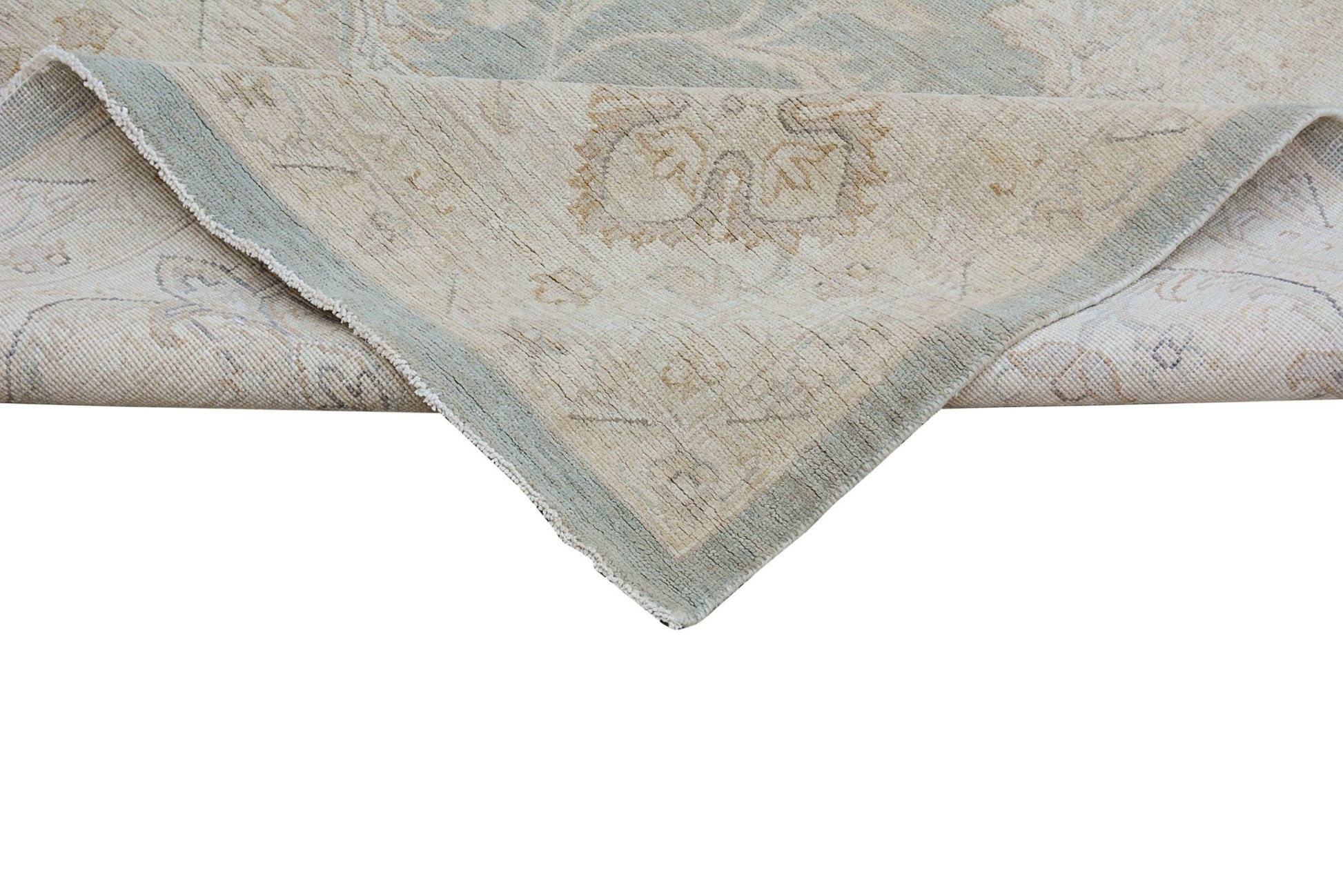 A handmade Afghan Chobi rug featuring a traditional floral pattern in soft beige and blue tones.