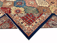 A handmade Afghan Chobi rug featuring a colorful geometric pattern with a folded corner.