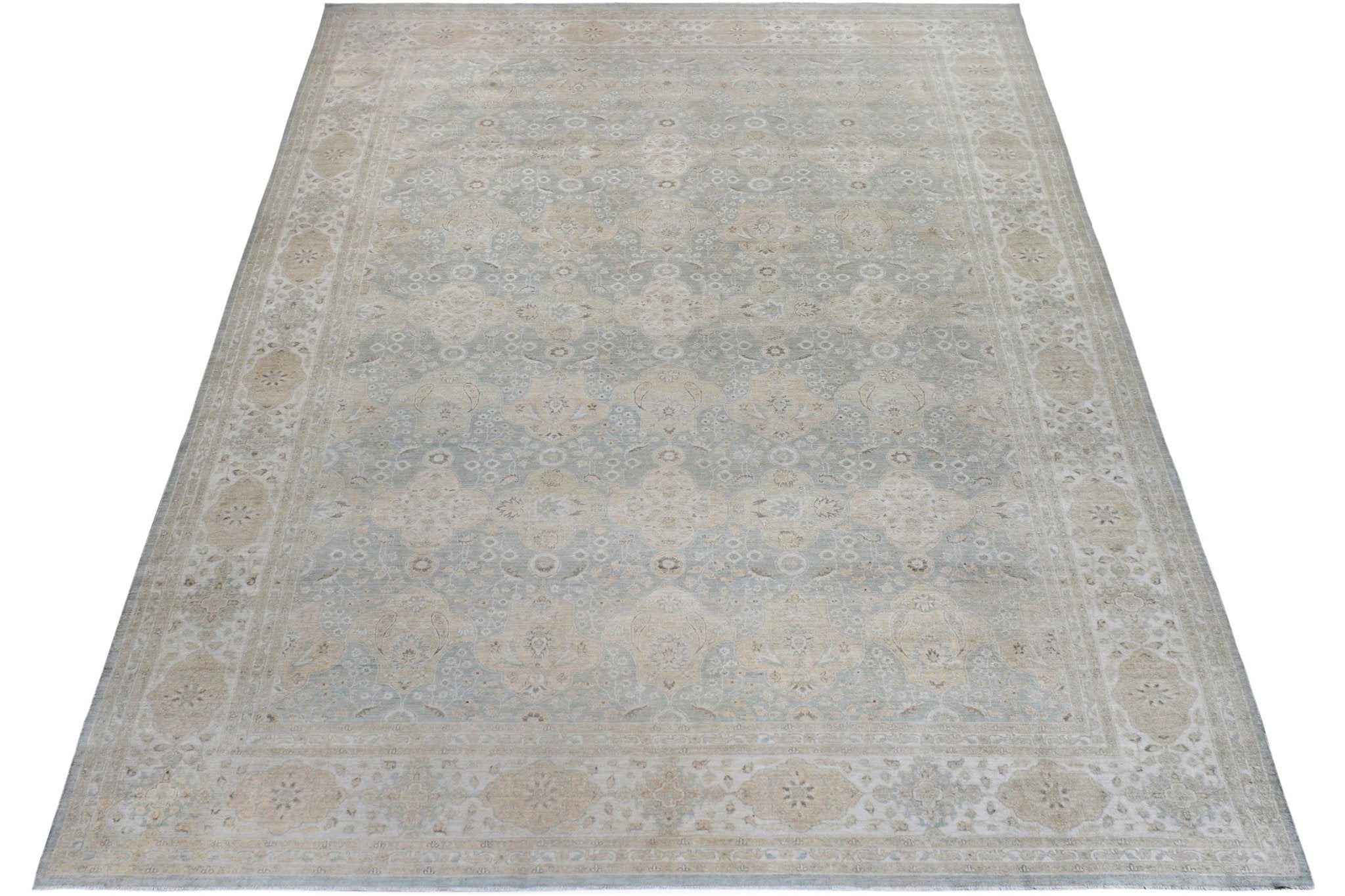 A large, rectangular Afghan Chobi rug featuring a traditional floral pattern in soft beige and blue.
