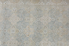 An Afghan Chobi rug featuring a traditional floral pattern in muted blue and beige tones.