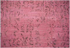 A handmade Afghan Chobi rug featuring a distressed, overdyed pink pattern with dark brown motifs.