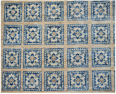 Handmade Afghan Chobi rug featuring a repeating blue and beige geometric floral square pattern.