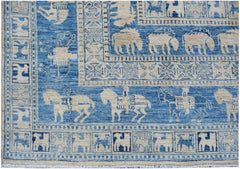 A blue and cream Afghan Chobi rug featuring traditional Pazyryk horse and rider motifs.