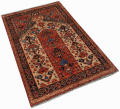 A handmade Afghan Chobi prayer rug featuring a traditional floral pattern in red and beige tones.