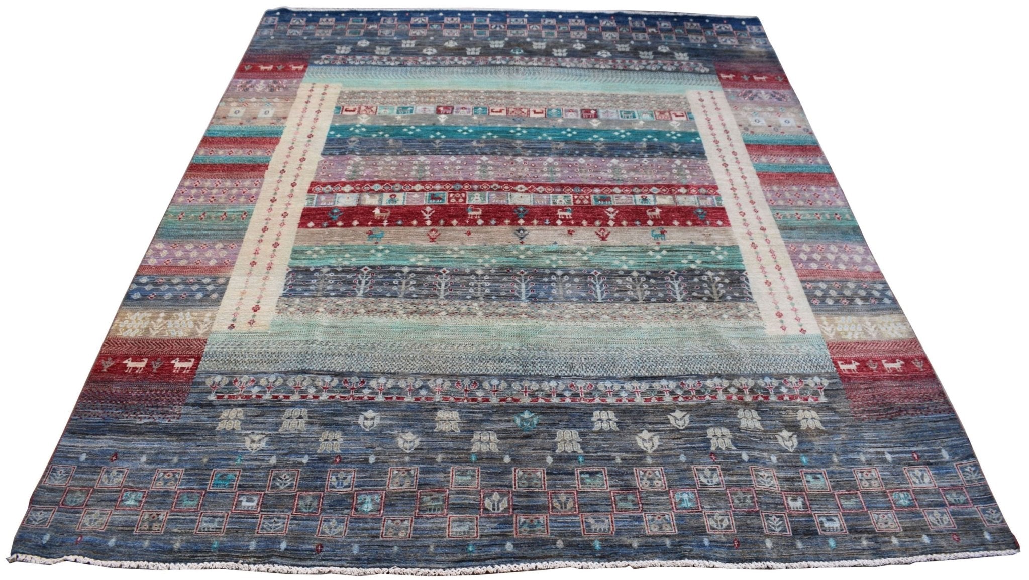 A handmade Afghan Chobi rug featuring horizontal bands of geometric patterns in earthy tones.