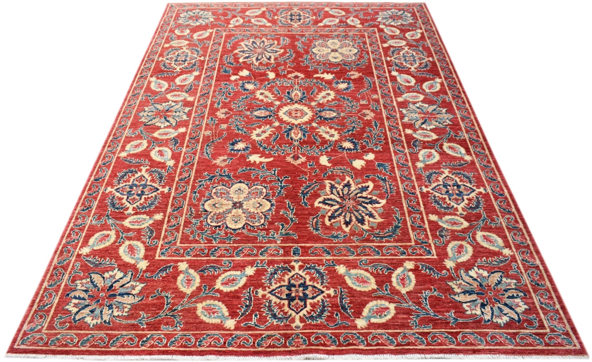 A rectangular Afghan Chobi rug featuring a traditional red field with intricate floral motifs.