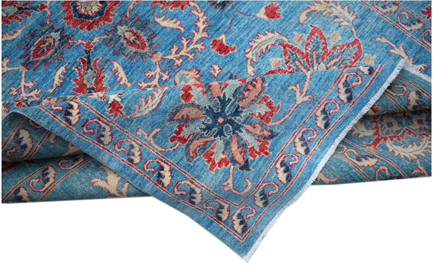A handmade Afghan Chobi rug featuring a blue field with traditional red and cream floral motifs.