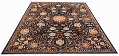 Handwoven Afghan Chobi rug featuring a traditional floral Suzani pattern on a dark brown background.