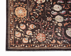 A handmade Afghan Chobi rug featuring a dark brown field with intricate floral and vine patterns.