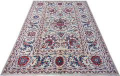 An Afghan Chobi rug featuring a traditional Suzani floral pattern in red and blue on a cream base.