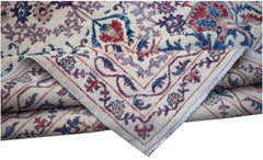 A handmade Afghan Chobi rug featuring a traditional Suzani floral pattern in red and blue tones.