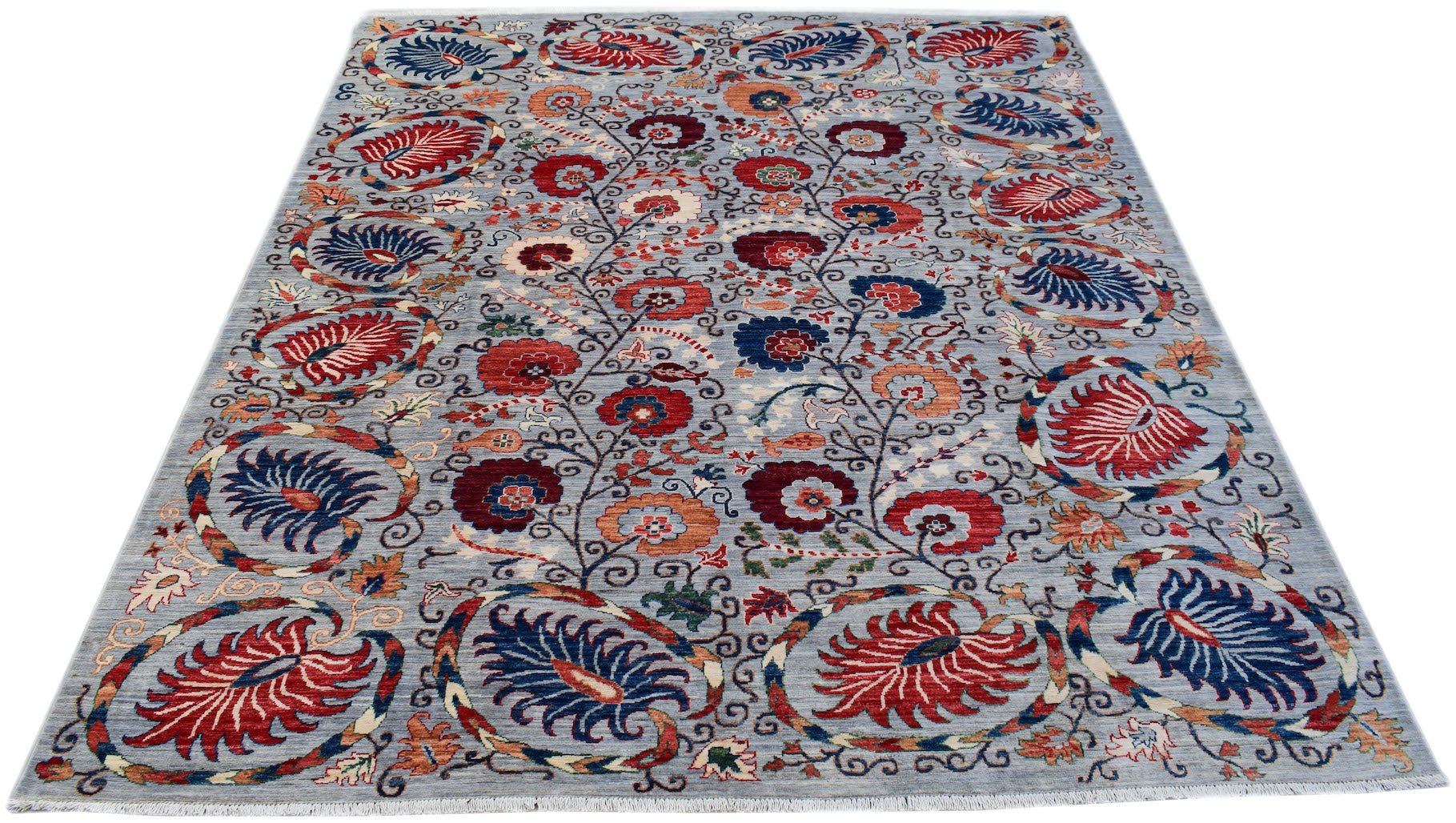 An Afghan Chobi rug featuring a floral Suzani pattern in red and blue on a light grey background.