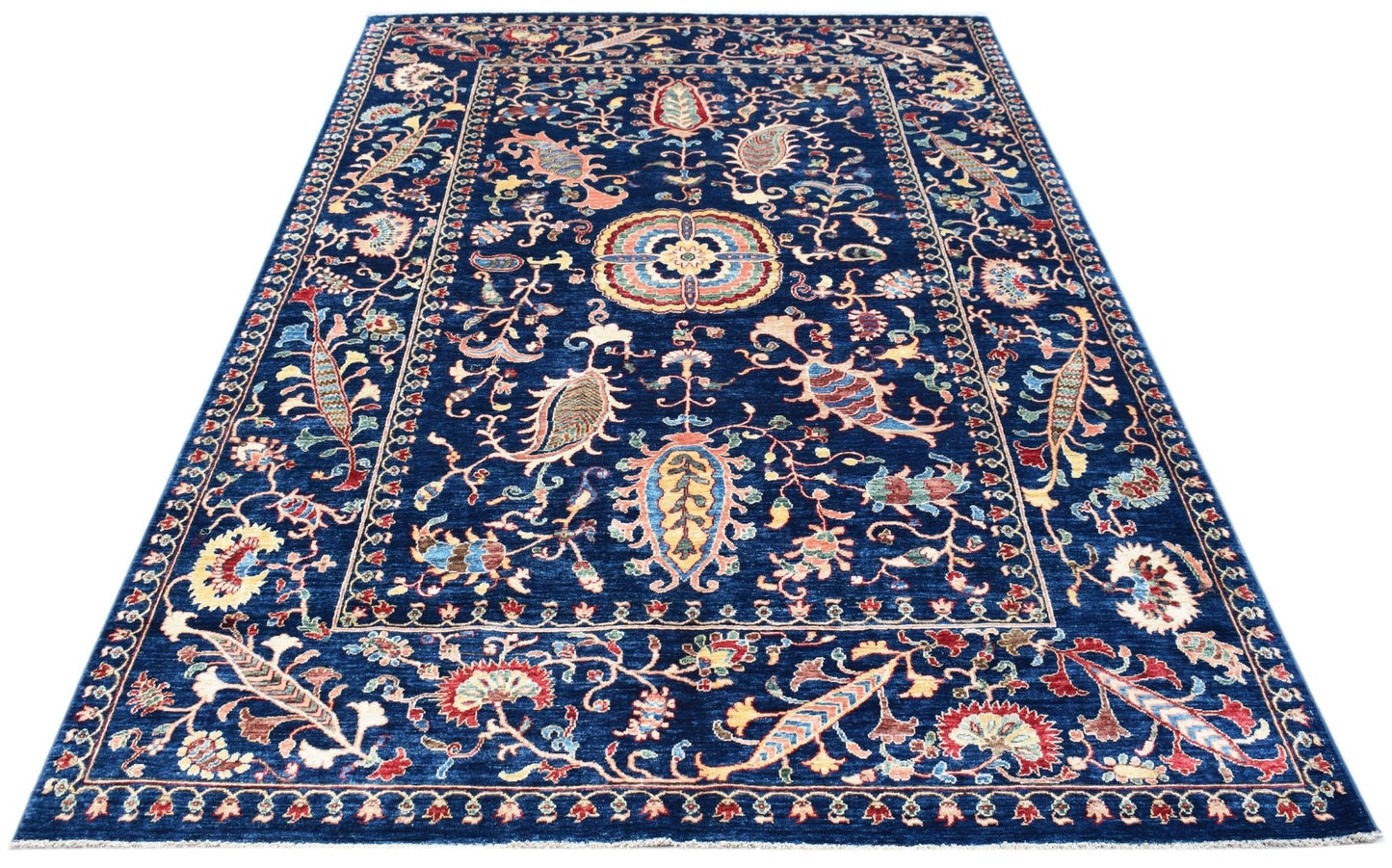 A rectangular Afghan Chobi rug featuring a traditional floral Suzani pattern on a deep blue field.