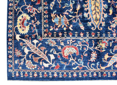 A handmade Afghan Chobi rug featuring intricate floral patterns in shades of blue and red.