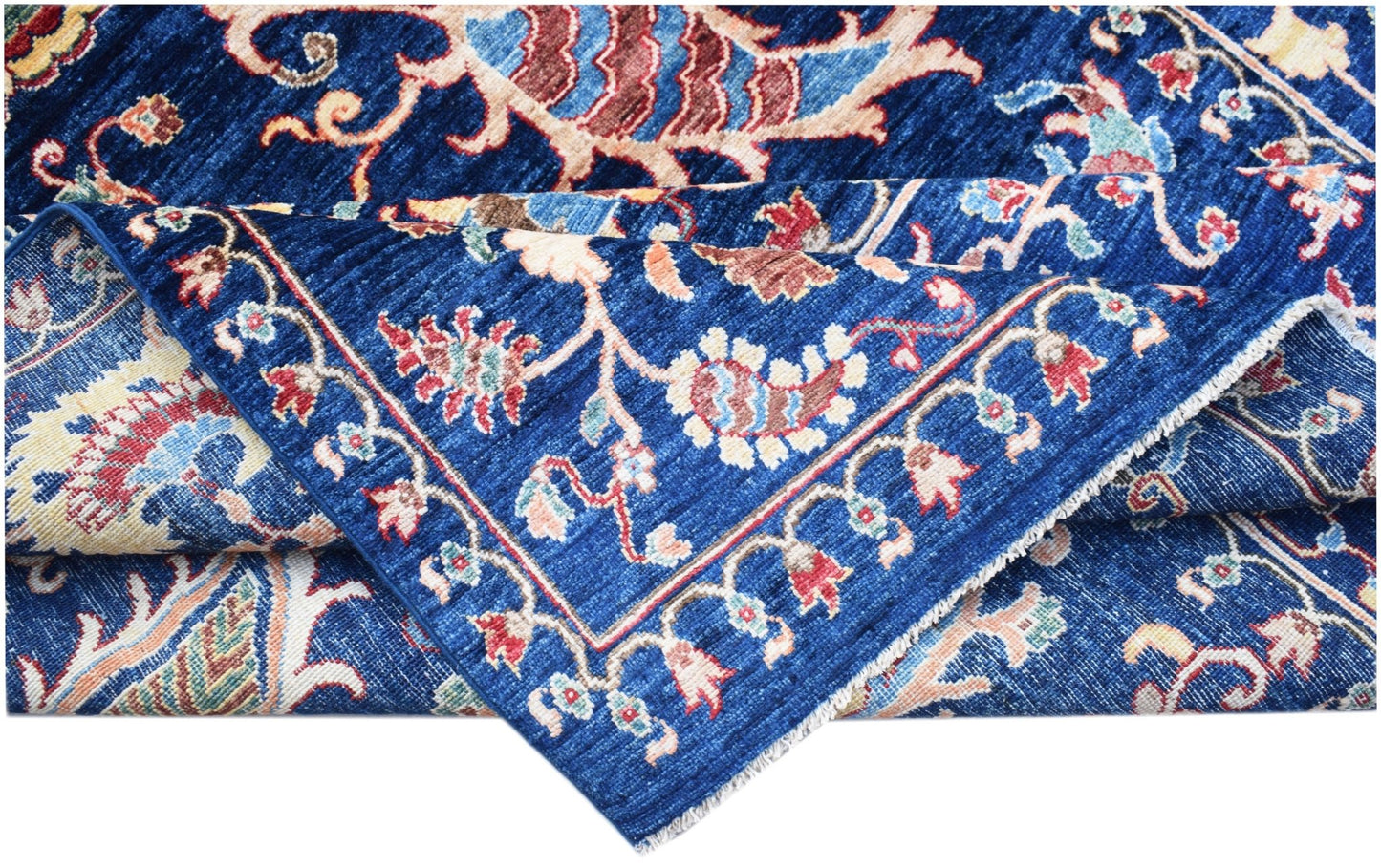 A handmade Afghan Chobi rug featuring a traditional floral pattern in blue, red, and cream tones.