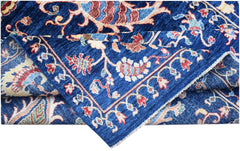 A handmade Afghan Chobi rug featuring a traditional floral pattern in blue, red, and cream tones.