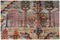 Handwoven Afghan Chobi rug featuring a traditional Tree of Life pattern in earthy tones.