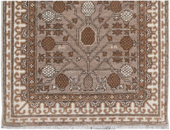 A handmade Afghan Chobi runner featuring a brown and cream geometric tree of life pattern.