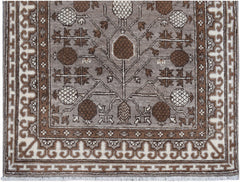 Handmade Afghan Chobi runner rug featuring a brown and cream geometric tree of life pattern.