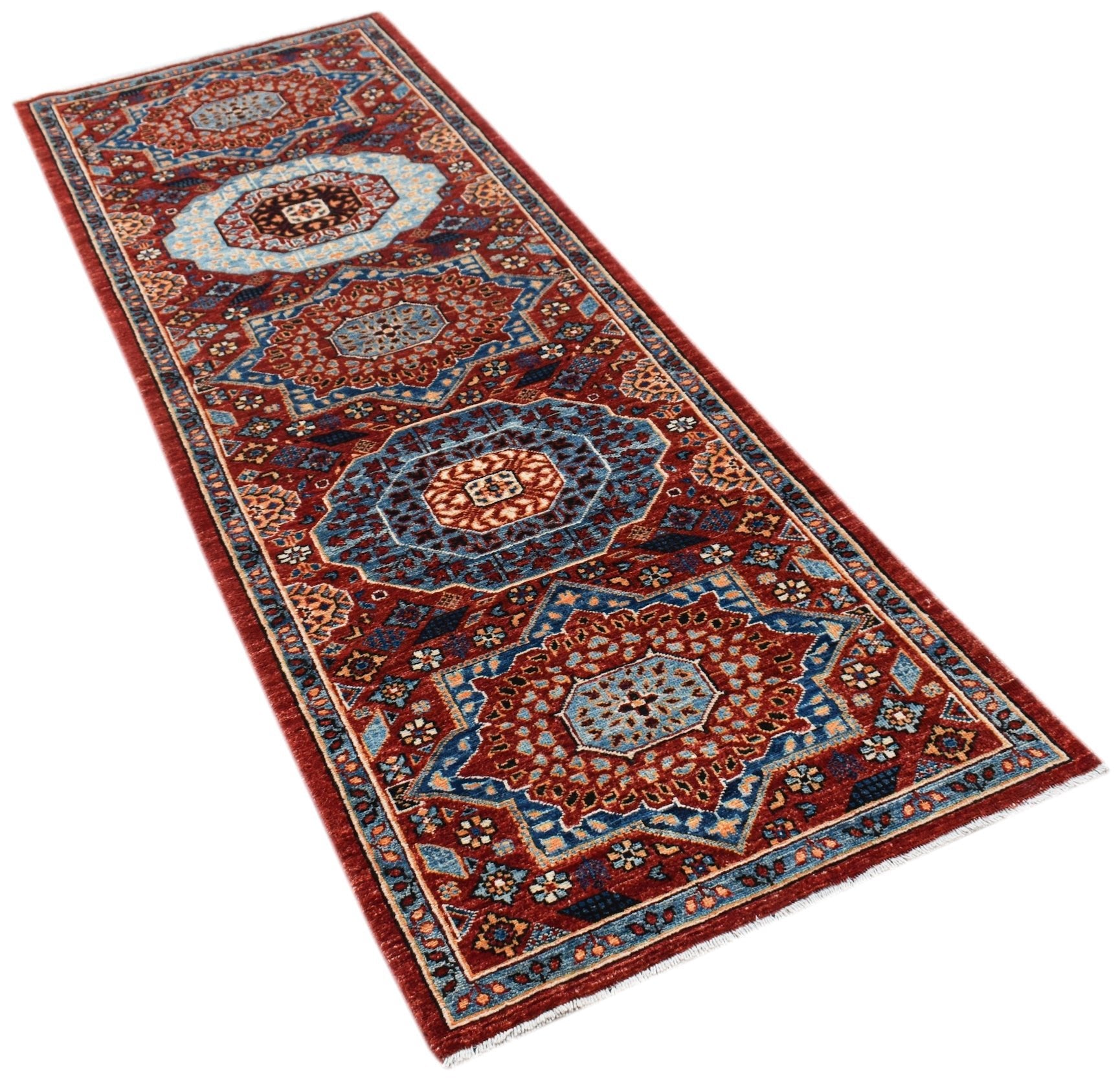 A handmade Afghan Chobi runner featuring a traditional Mamluk pattern in red and blue tones.