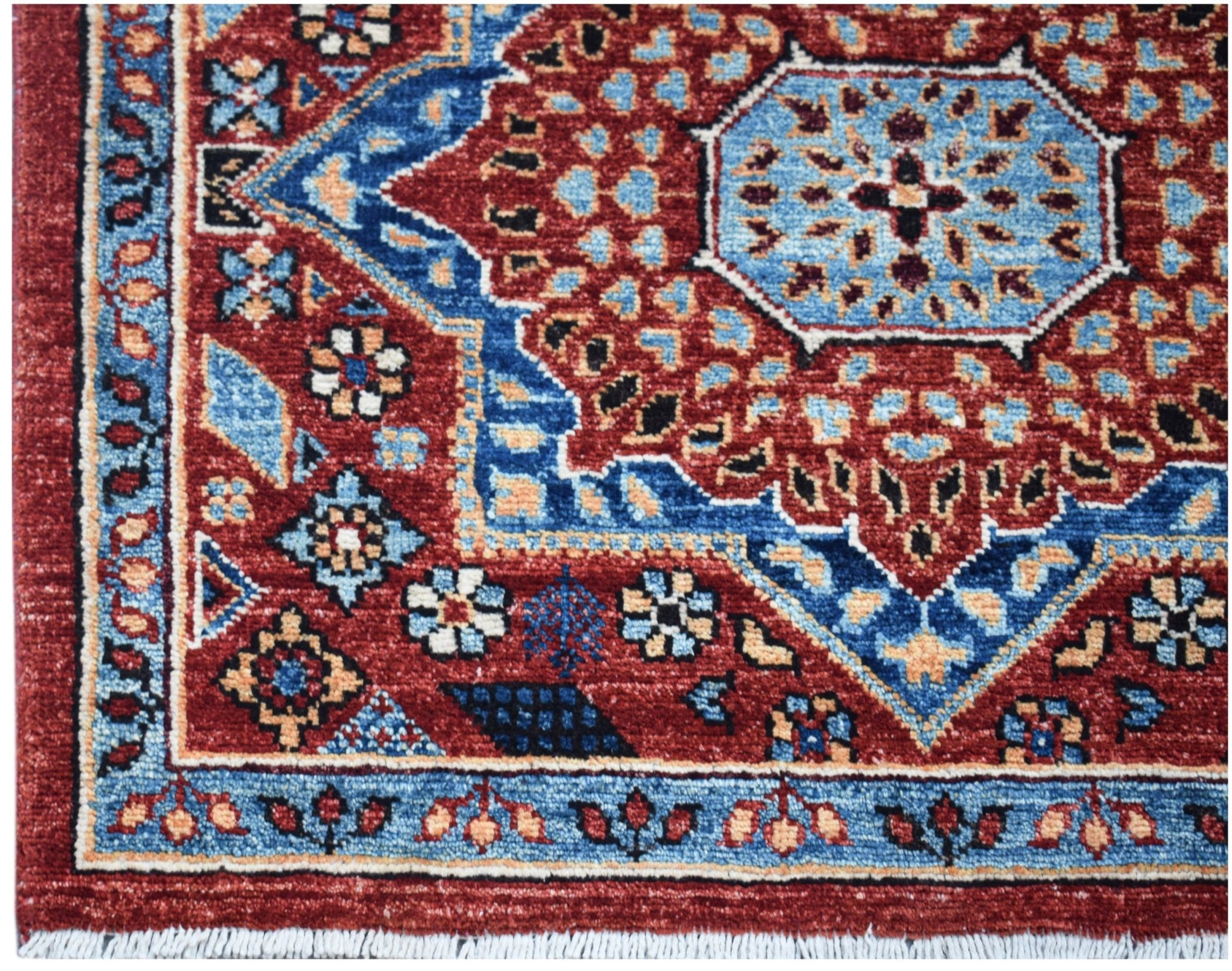 A handmade Afghan Chobi runner featuring a detailed Mamluk medallion pattern in red and blue.