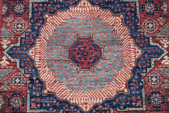 A handmade Afghan Chobi runner featuring a detailed Mamluk medallion in red and blue wool.