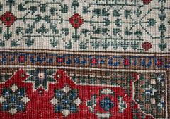 A close-up of a handwoven Afghan Chobi runner featuring a traditional Mamluk geometric pattern.