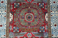 A handmade Afghan Chobi runner featuring a detailed Mamluk medallion pattern in red and blue.