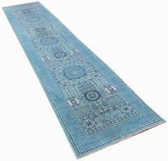 A handmade Afghan Chobi runner rug featuring a blue Mamluk pattern with intricate medallions.