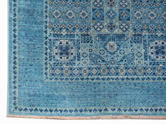 A handmade Afghan Chobi runner rug featuring intricate blue geometric Mamluk patterns.
