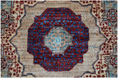 A handmade Afghan Chobi runner featuring a central geometric medallion in red, blue, and tan.