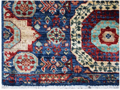 Handmade Afghan Chobi runner rug featuring a blue field with intricate red and teal medallions.