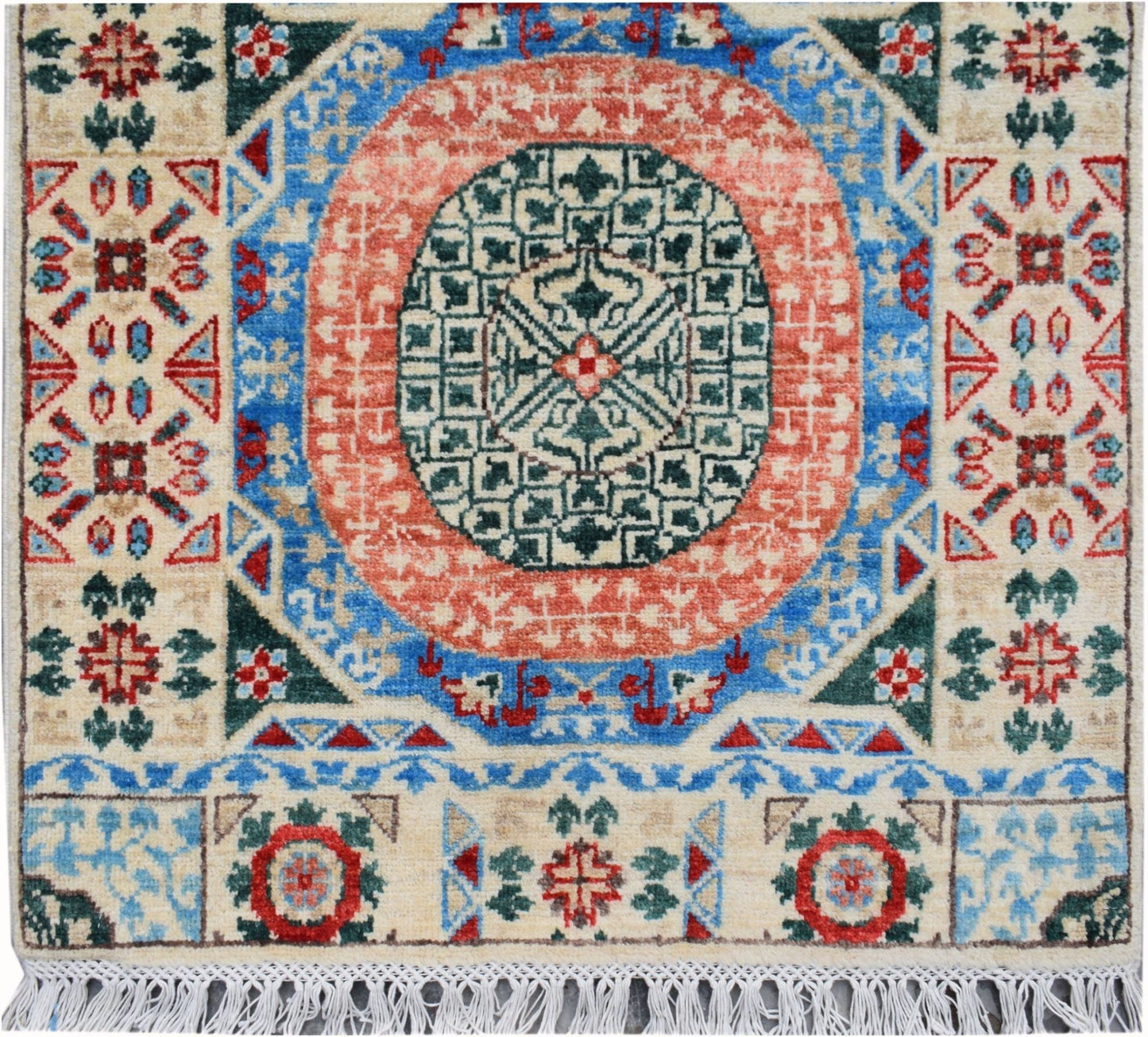 A handmade Afghan Chobi runner featuring a central geometric medallion in red, blue, and green.