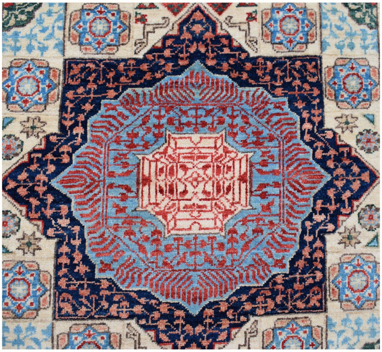 A handmade Afghan Chobi runner featuring a complex geometric Mamluk medallion in blue and red.