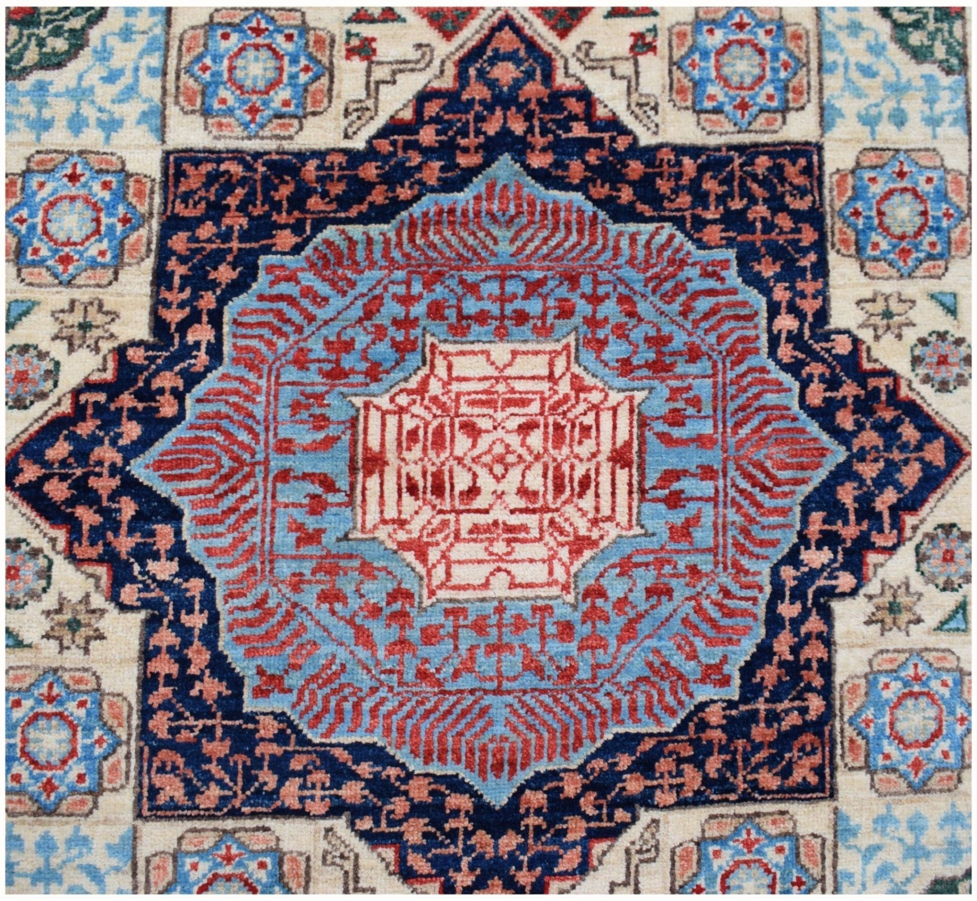 A handmade Afghan Chobi runner featuring a complex geometric Mamluk medallion in blue and red.