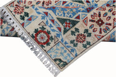 A handmade Afghan Chobi runner featuring a geometric Mamluk pattern in blue, red, and green.