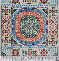 A handmade Afghan Chobi runner featuring a central geometric medallion in red, blue, and green.