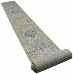 A long, handwoven Afghan Chobi runner rug featuring traditional geometric patterns in blue and gold.